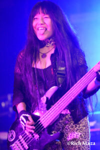 Missy from PowerTribe smiling on stage with tongue out while looking at the audience at the Whisky a Go Go